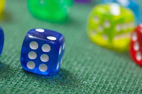 Colorful Dice on green table — Stock Photo, Image