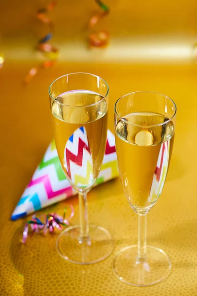 champagne glasses with birthday hat