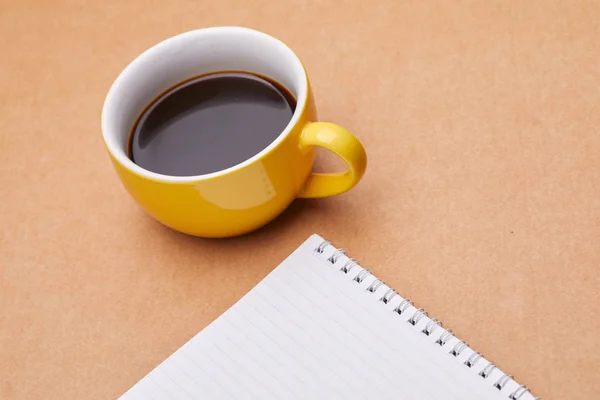 Cup of coffee with paper sheet Stock Image