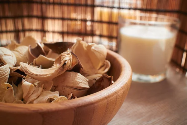 dry plants in wooden bowl, spa concept