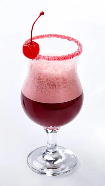 sweet alcohol cocktail with cherry on white background