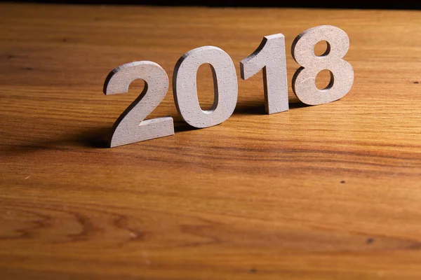 Decorative numerals 2018 on wooden table — Stock Photo, Image