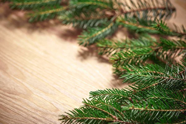 Tarjeta Navidad Con Ramas Abeto Sobre Fondo Madera —  Fotos de Stock