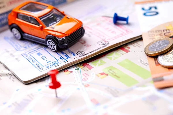 small toy car on map, travel concept