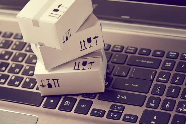 little delivery packaging boxes on keyboard, close view