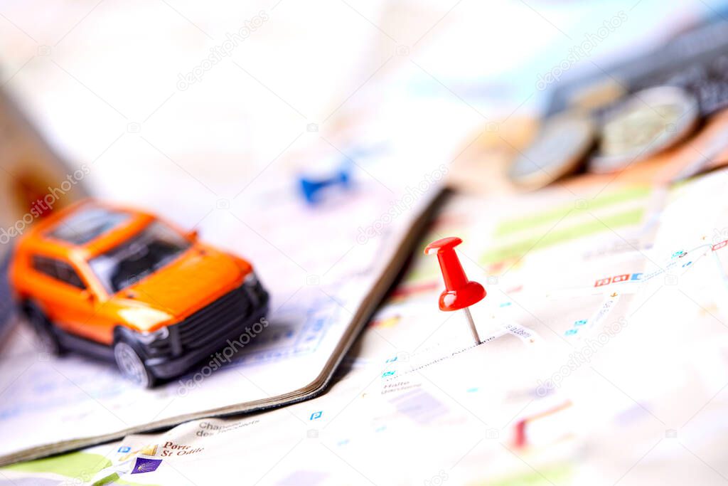 small toy car on map, travel concept 