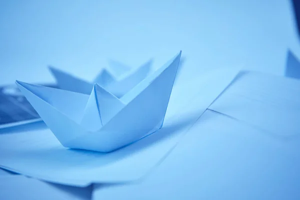 paper boats on documents, business concept