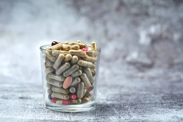 Medicine Pills Capsules Glass Grey Surface — Stock Photo, Image