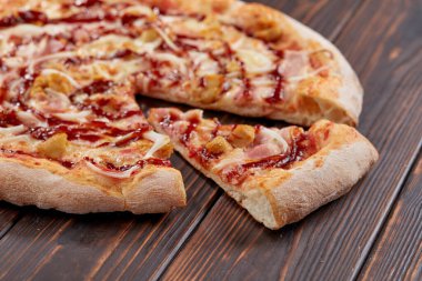 tasty pizza on wooden background, close-up 