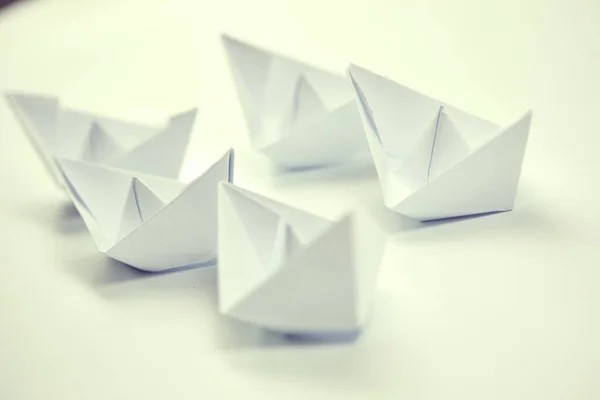 paper boats on documents, business concept