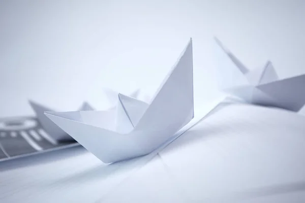 paper boats on documents, buissines concept
