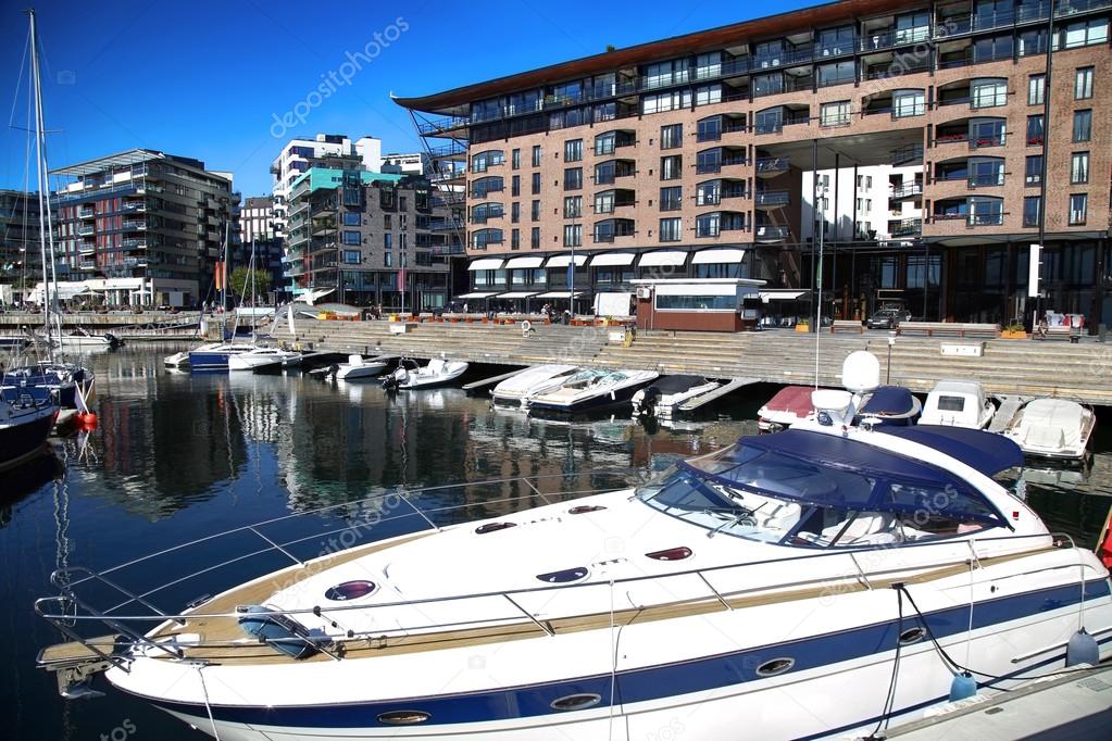 Yacht and modern district on street Stranden, Aker Brygge in Osl