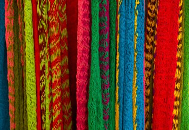 Close-up of multi-colored hammocks