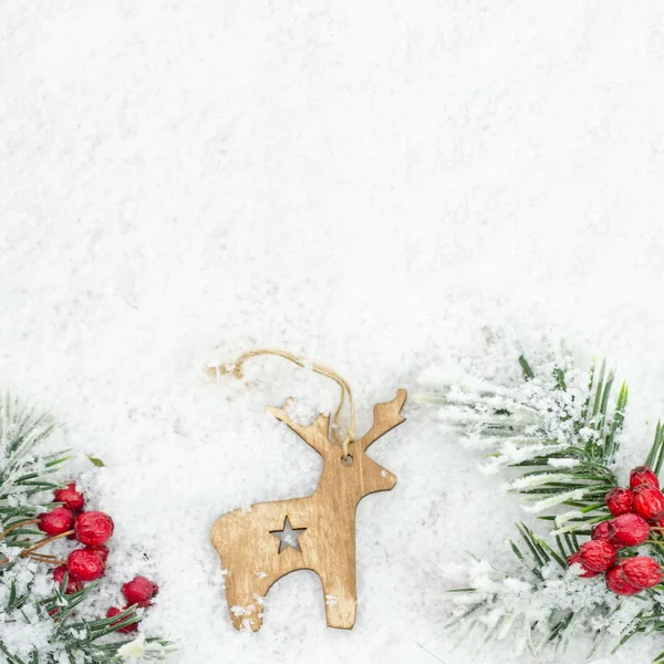 Christmas background with wooden reindeer — Stock Photo, Image