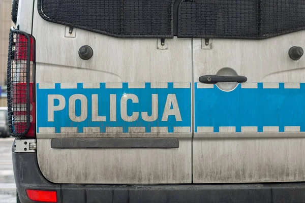 Cartel de la policía polaca en una puerta del coche de policía —  Fotos de Stock