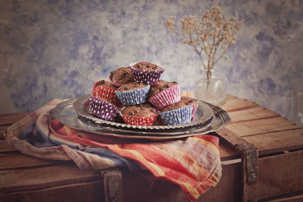 Mini chocolate cupcakes on silver plate in rustic style — Stock Photo, Image