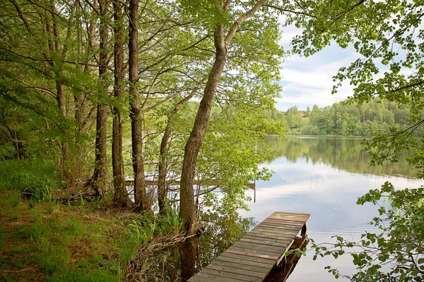 Old fishing bridge on the lake — Stock Photo, Image