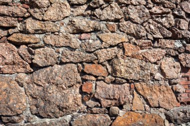 Vyborg artillery building, a fragment of a wall made of raw red granite clipart
