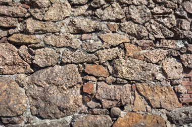 Vyborg artillery building, a fragment of a wall made of raw red granite clipart