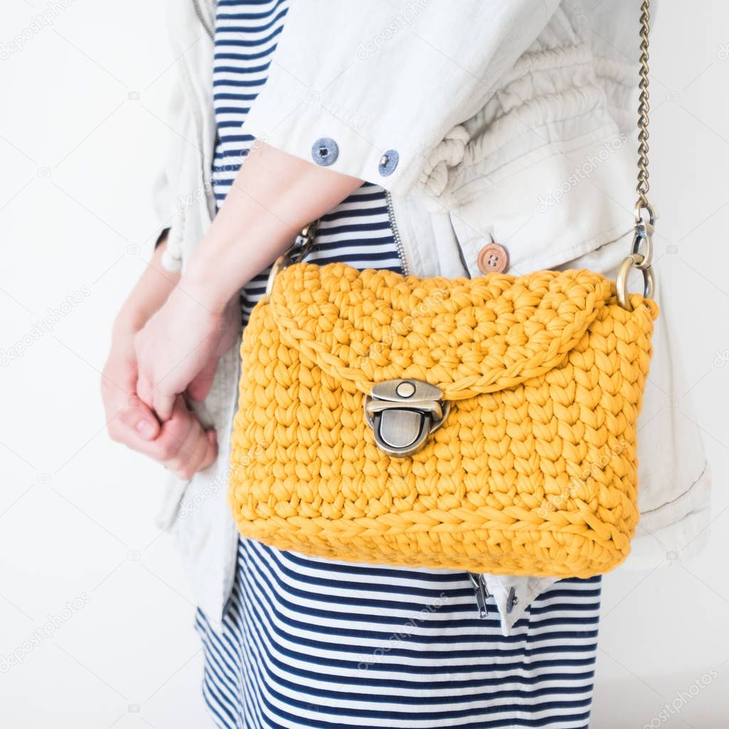 Close up photo of woman bag with fashionable woman