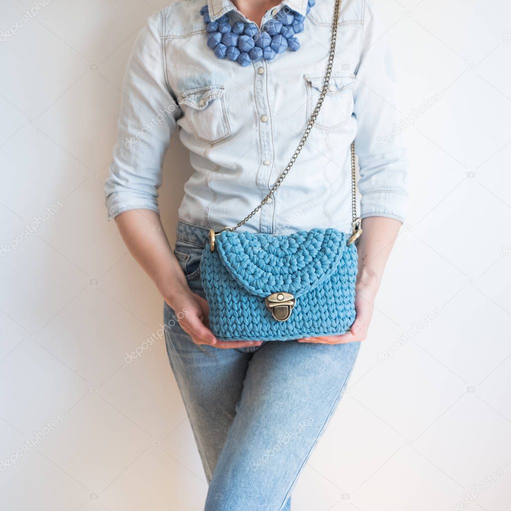 Close up photo of woman bag in hands of fashionable woman