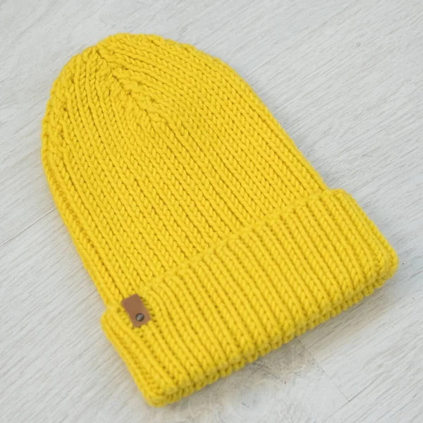 Cozy knitted yellow hat — Stock Photo, Image