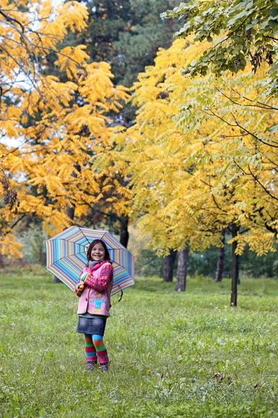 Happy little girl in park autumn season — Stock Photo, Image