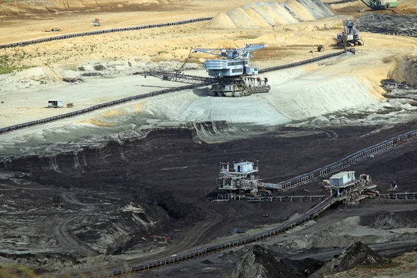 Open pit coal mine with heavy machinery — Stock Photo, Image