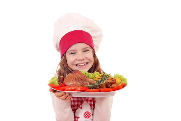 Happy little girl cook with roasted turkey drumstick — Stock Photo, Image