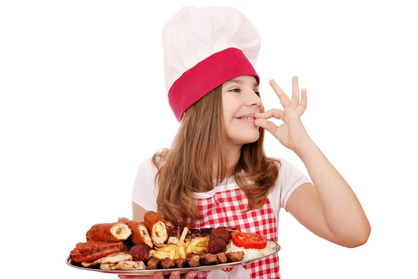 Little girl cook with grilled meat on plate and ok hand sign — Stock Photo, Image