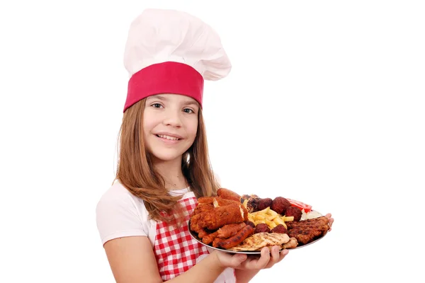 Little girl cook with grilled meat on plate — Stock Photo, Image