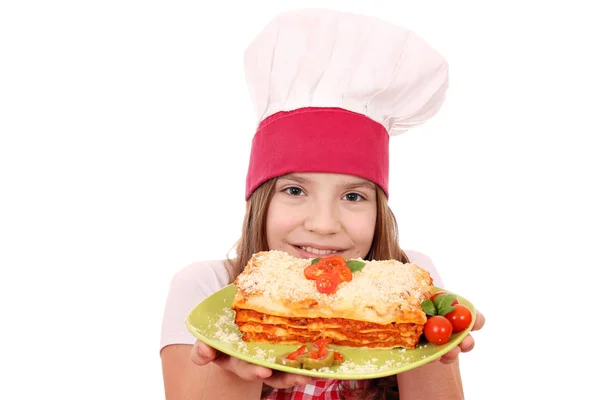 Happy little girl cook with lasagne — Stock Photo, Image