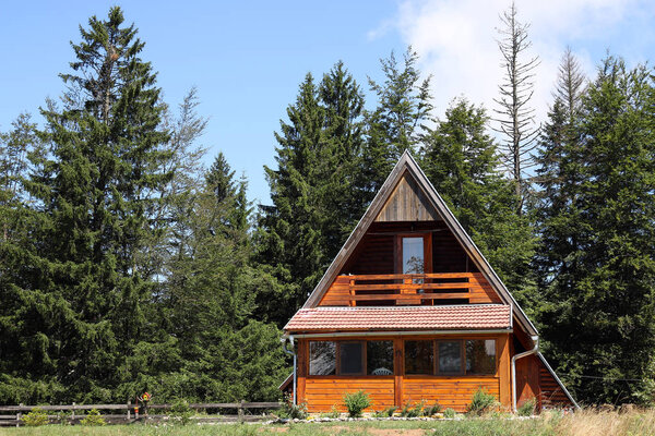 wooden hut on mountain summer season
