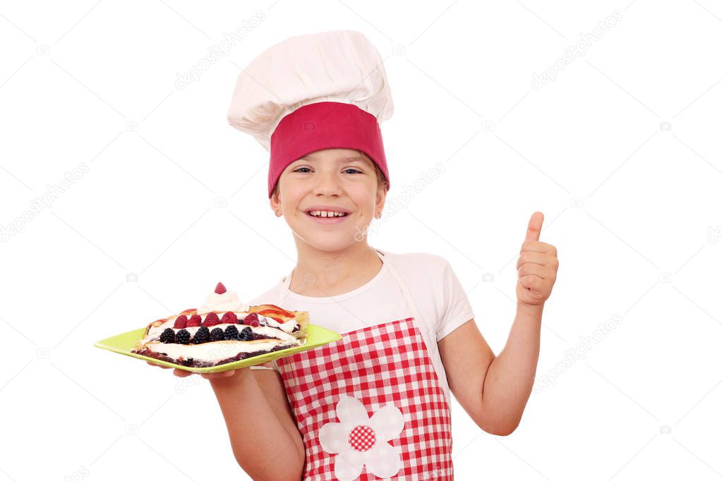 happy little girl cook with crepes on plate and thumb up