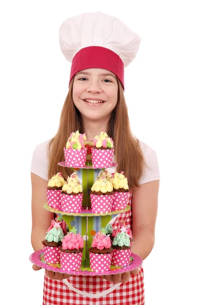 Gelukkig klein meisje koken met muffins zoet dessert — Stockfoto