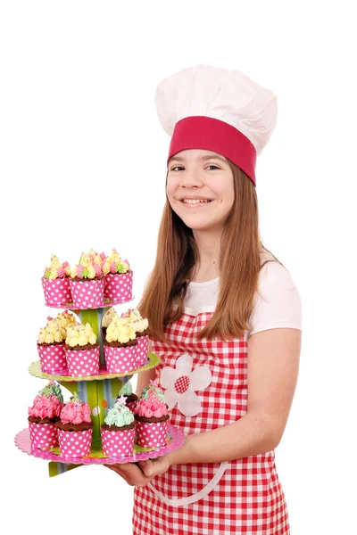 Menina feliz cozinhar com muffins doces — Fotografia de Stock