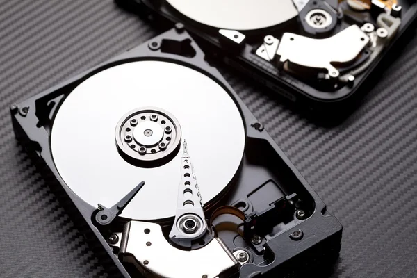 Two hard disk drive on carbon background — Stock Photo, Image