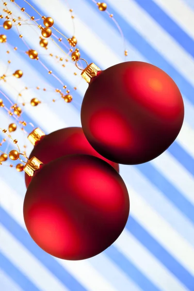 Christmas baubles on patterned background — Stock Photo, Image