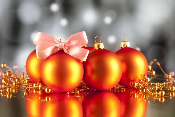 Christmas baubles, ornaments and pink bow — Stock Photo, Image