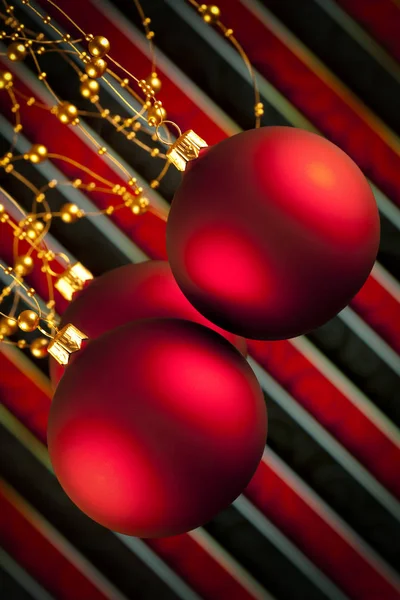 Three Christmas baubles on red and black background — Stock Photo, Image