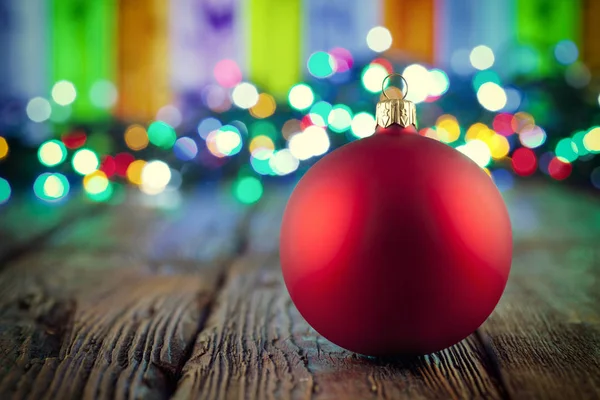 Christmas bauble on wooden table — Stock Photo, Image