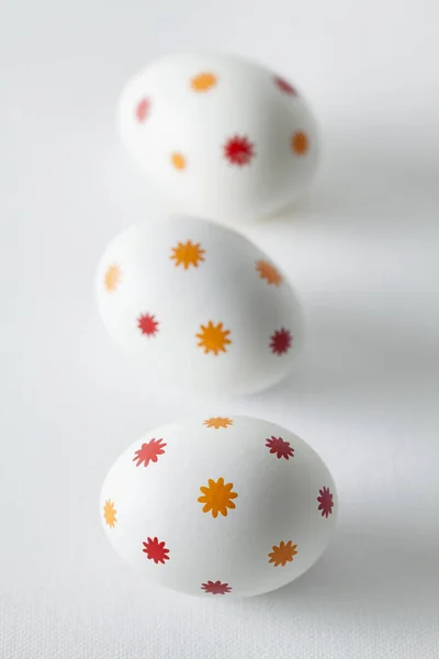 Patterned easter eggs on plastered background — Stock Photo, Image
