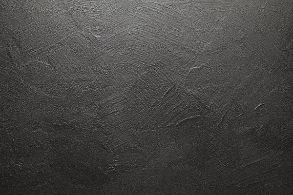 Uneven surface of plastered wall - black background or texture — Stock Photo, Image