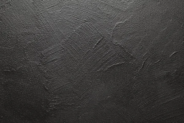 Uneven surface of plastered wall - black background or texture — Stock Photo, Image