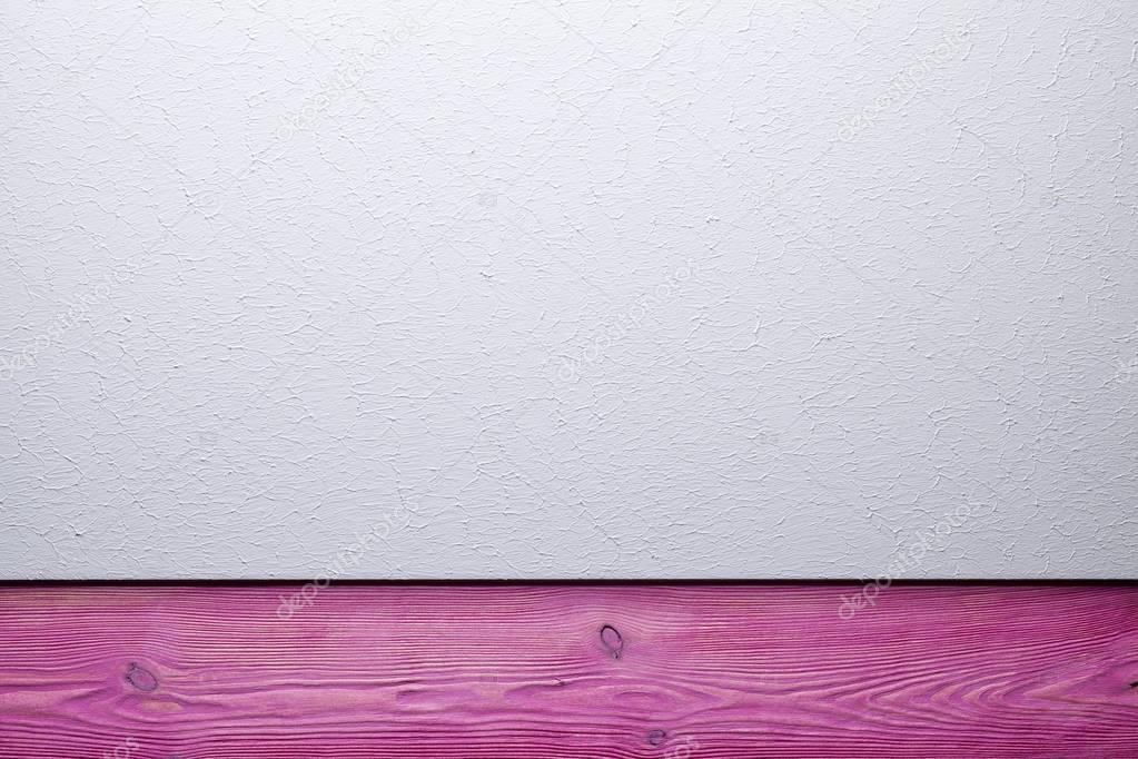 Two layer background - plastered surface and pink wooden plank