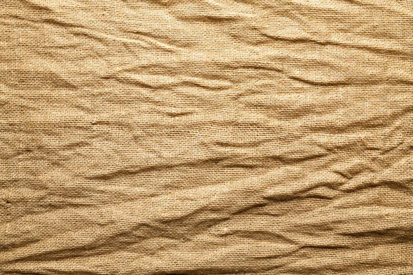 Saco de juta enrugada fundo ou textura — Fotografia de Stock