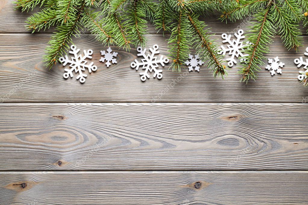 Christmas background - spruce tree and snowflakes on wooden boar ...