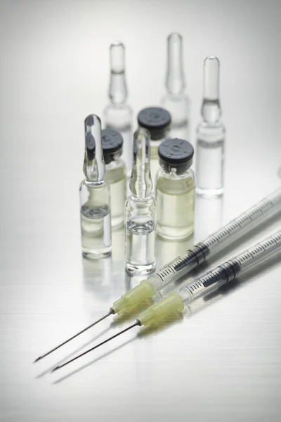 Ingredients for injection - syringes with needles, medicine and