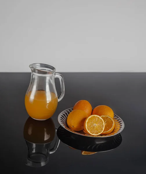 Jug with orange juice and fruits  isolated — Stock Photo, Image