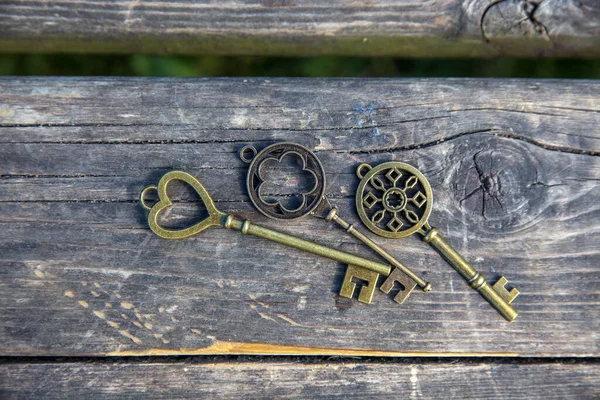 old vintage keys at wooden texture